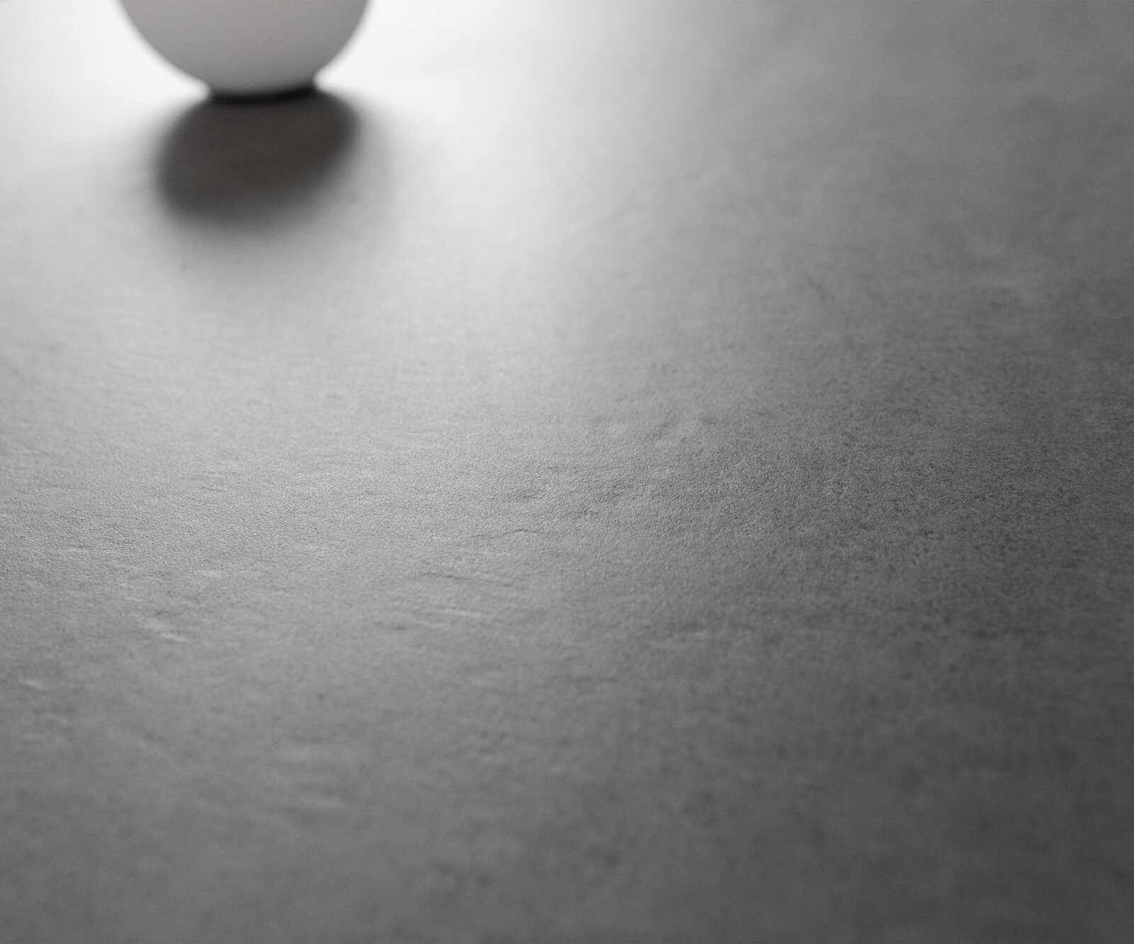 Eettafel Edge boot 200x100 cm keramiek beton grijs roestvrij staal schuin 4